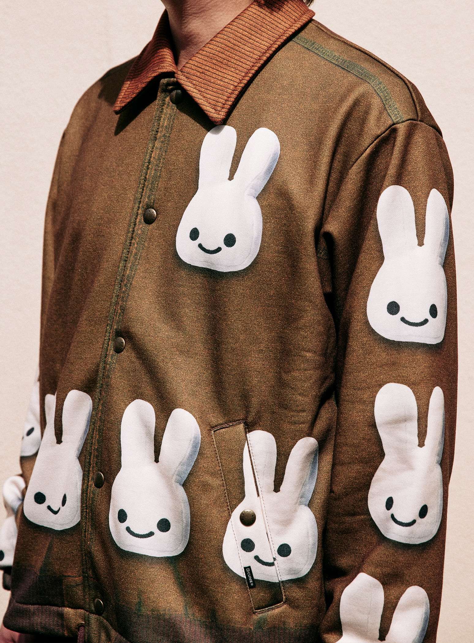 Sweatshirt coach jacket with coverall print